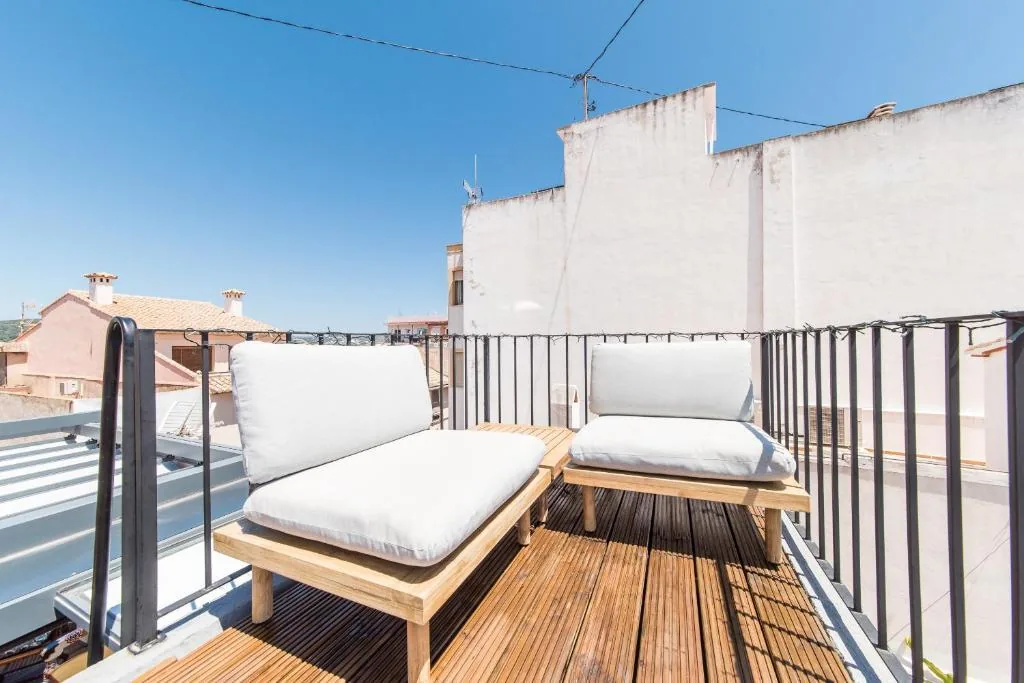 Private upper sun deck with two cushioned loungers